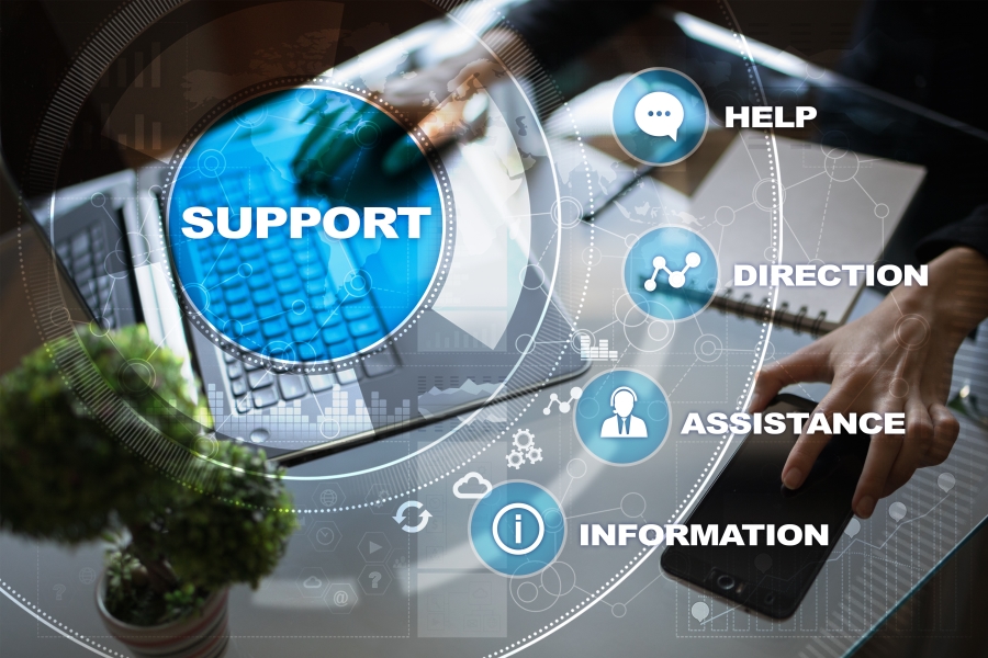 An image of a laptop and phone with text over saying 'Support' then smaller text saying 'help', 'direction', 'assistance', and 'information' to represent the services Kazzicom offers
