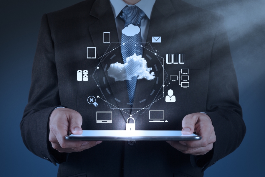 A man holding a light box with graphics around representing SaaS services