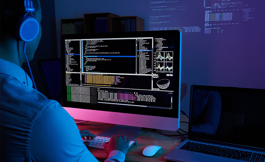 Someone coding on a computer representing Kazzicom cleaning ERP systems