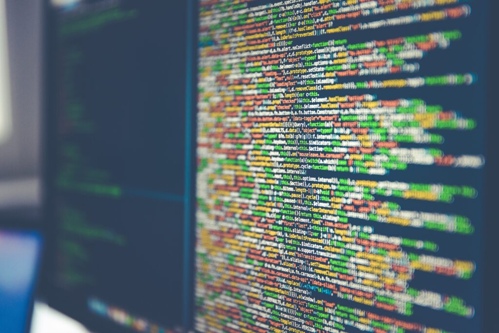 A close up image of a monitor screen showing coding
